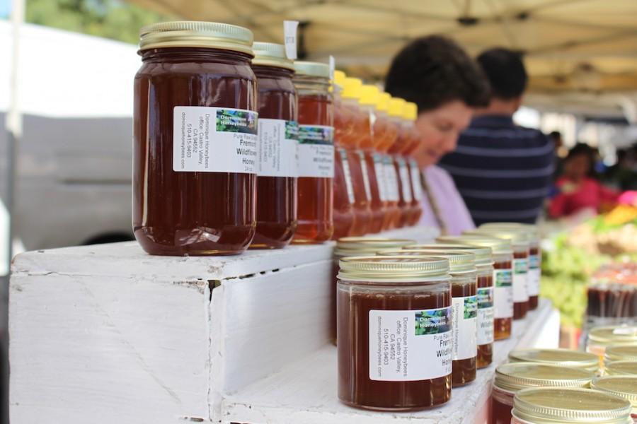 A booth at the Farmer's Market is stocked with Fremont Wildflower Honey. Recent losses in honeybee populations have concerned agricultural communities.