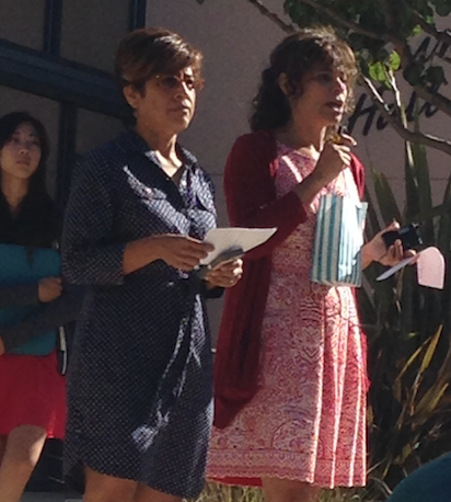 Teachers Pilar Aguero-Esparza and Lola Muldrew announce the dress code forum at a class meeting. The dress code has been a popular point of discussion at the upper school.