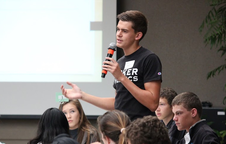 Arben Gutierrez (11) speaks at the Harker Summit. The event brought together students to discuss ways to improve the environment and community.