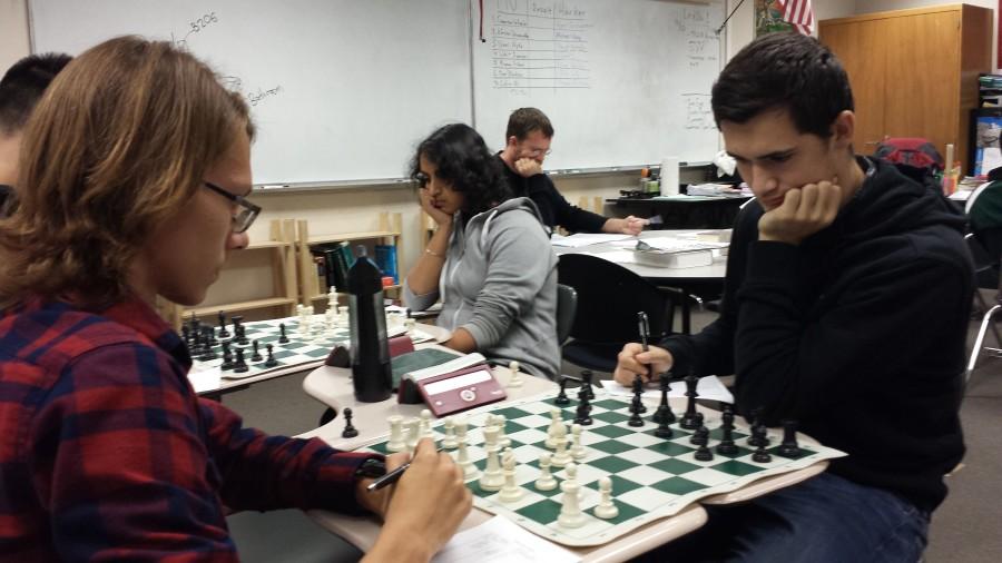 Evan Lohn (12) and Ananya Krishnan (10) face off with their opponents during a chess match against Monta Vista High. The uper school chess team lost to last years National HS champion Monta Vista. 