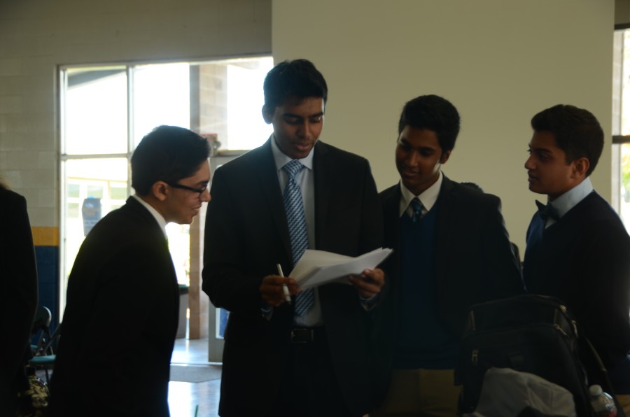 Public forum debaters Sorjo Banerjee (12) and Abhinav Ketineni (12) prepare for the first round of the tournament in the practice room. Abhinavs team advanced to the octofinal round oft he tournament, while Sorjos team advanced to the finals. 
