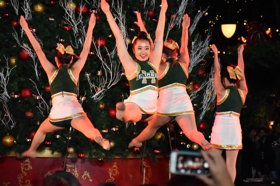 Liana Wang (10) leaps during a varsity dance routine at the Santana Row tree lighting ceremony. The ceremony took place last Tuesday. 