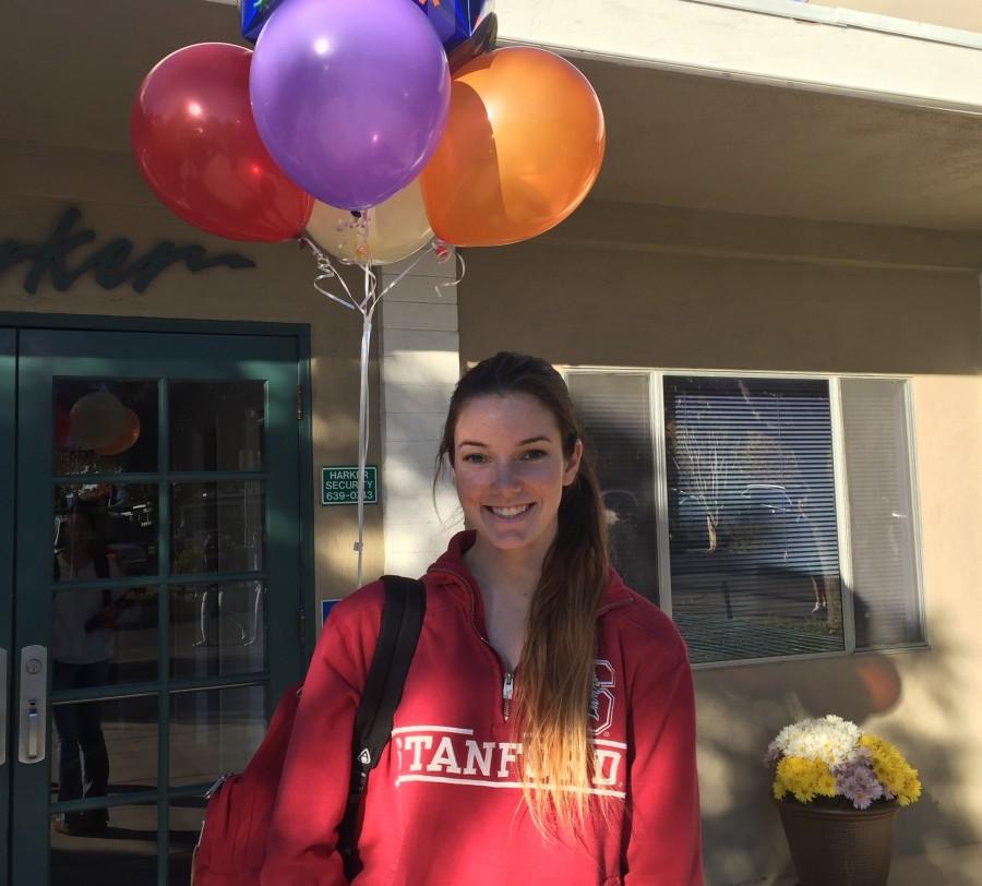 Shannon Richardson (12) smiles while carrying congratulatory balloons from friends and family today in front of Main after signing the Letter of Intent. Following a period of verbal commitment, Shannon officially committed to playing for Stanford Volleyball.