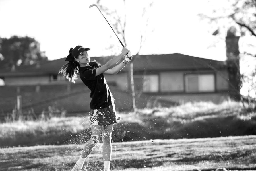 Senior Daphne Liang swings her club at one of the last golf matches of this past season.