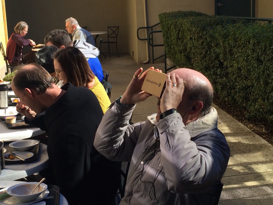 Substitute teacher John Heyes uses the Google Cardboard sent by The New York Times to its subscribers. Google is one of multiple companies now exploring the virtual reality industry.
