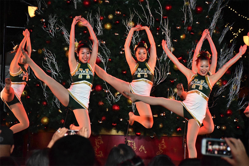 Members of varsity dance  perform during the Santana Row Tree Lighting Ceremony. The girls danced to an upbeat big band version of “Jingle Bells.”
