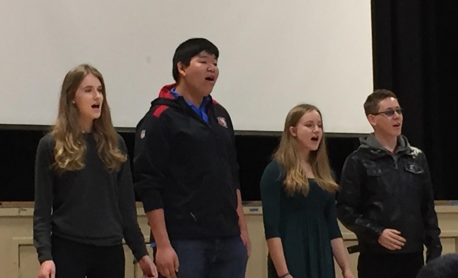 The upper school acoustics group sings God Bless the Child. They will perform at the concert I Dream A World at 6 p.m. in Nichols auditorium.
