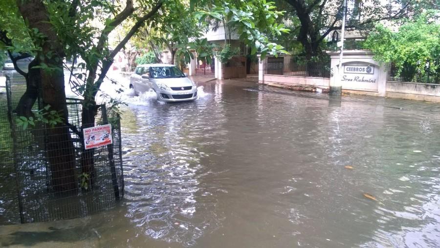 A car drives through a flooded road in Chennai. Heavy rainfall and faulty drainage systems caused flooding throughout southern India during the month of November and first week of December. 