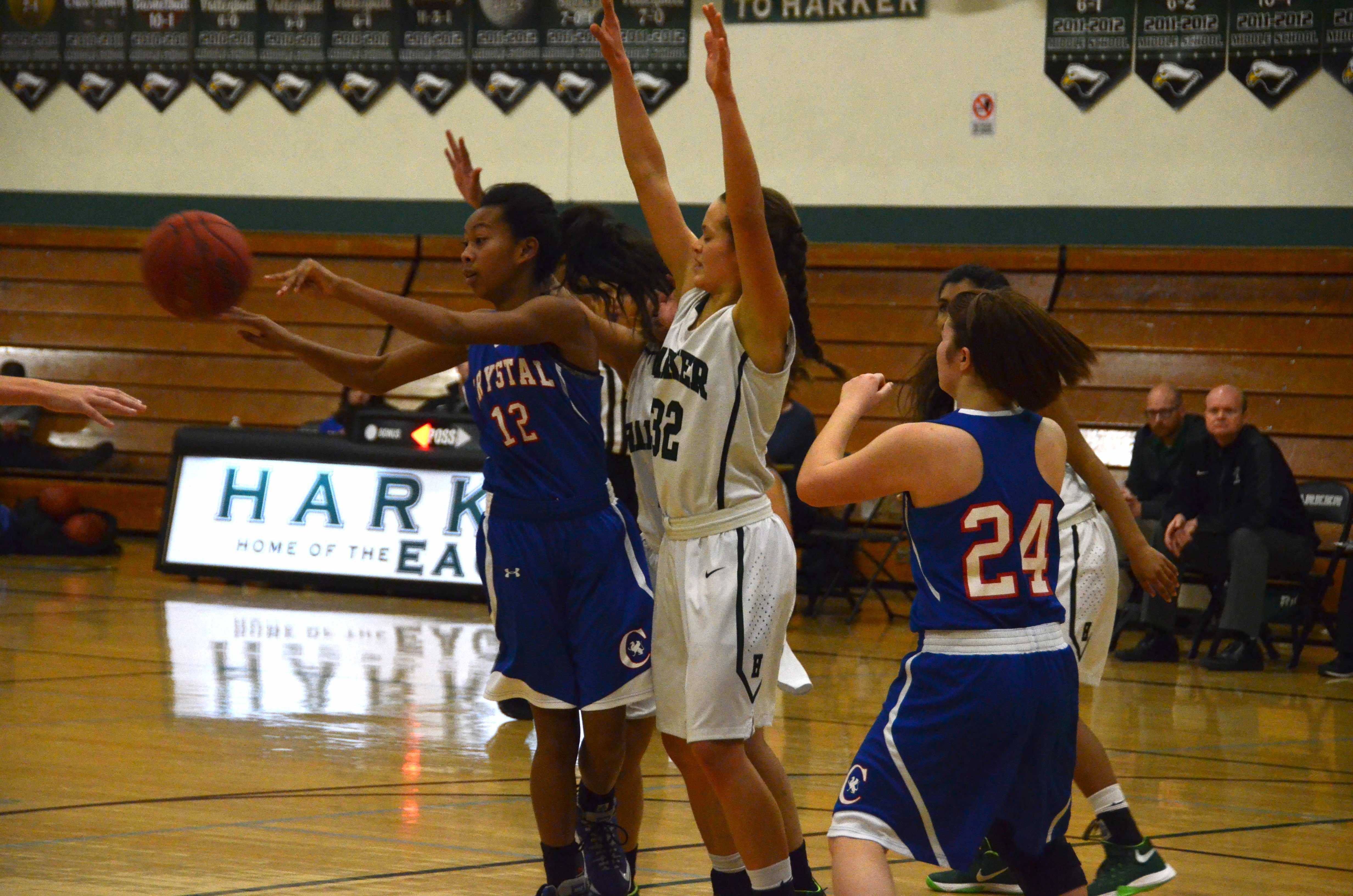 Jordan Thompson (11) guards the basket during the varsity basketball team’s match against Crystal Springs.