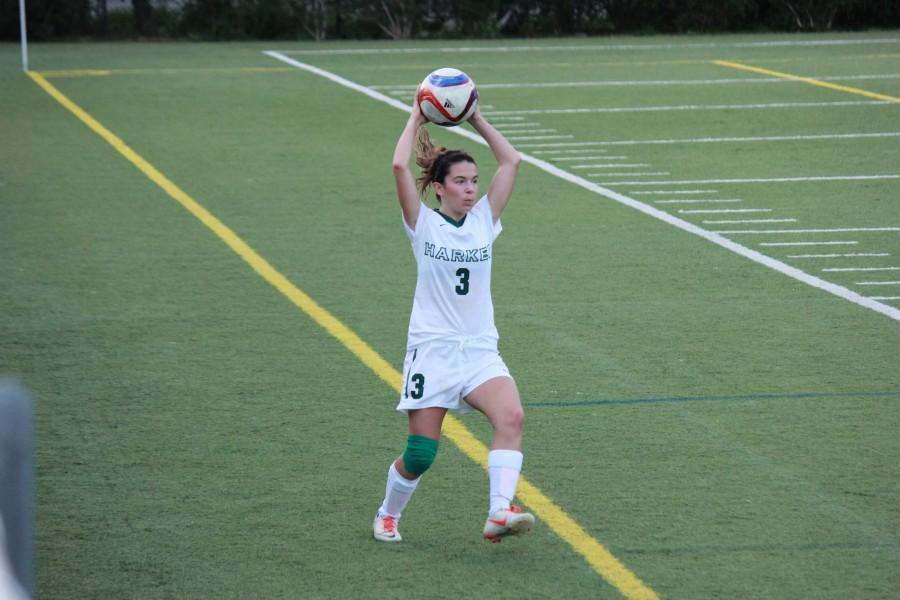 Junior Stephanie Scaglia prepares to throw the ball in during the teams match.