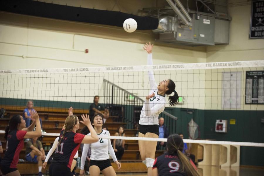 Senior Doreene Kang prepares to hit the ball over the net during a varsity game. She was mentioned in The Mercury News for volleyball.