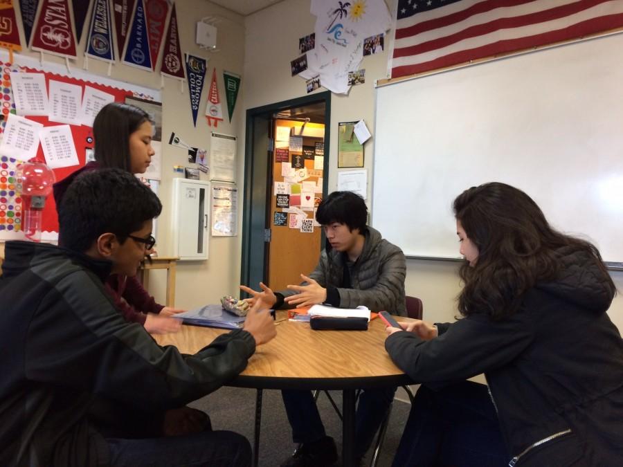 Ashwin Reddy (9), Tiffany Wong (9), Brian Park (9) and Grace Koonmen (10) discuss homework questions that were assigned. All four of these students are in Honors Algebra 2 with math teacher Jane Keller.
