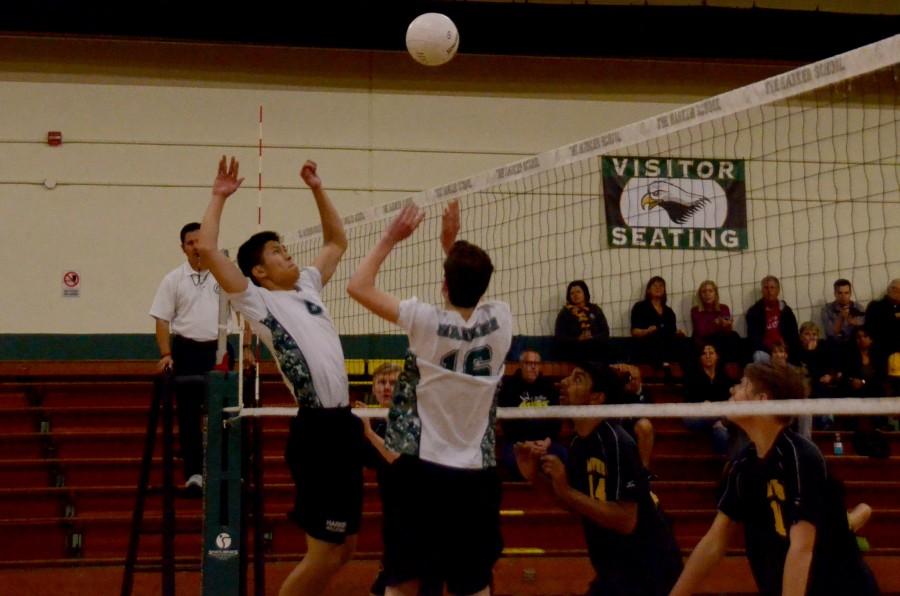 Ray Song (11) prepares to make a kill after Charlie Molin (9) sets the ball. Harker lost to Mountain View High School today after playing three sets.
