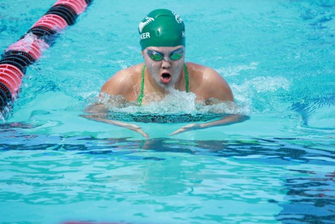 Upper school swim team competes against other schools in invitational swim meet