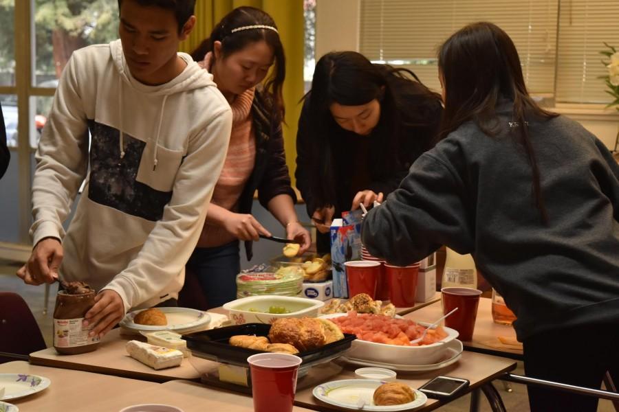 Students enjoy multiple food dishes during French Cultural Night. This event was held on March 8 in upper school teacher Galina Tchourilovas room. 
