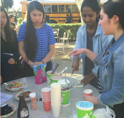 Seniors Nikita Ramoji and Ayla Ekici sell Pinkberry and other baked goods to raise funds for the Kenya Center for Excellence. 