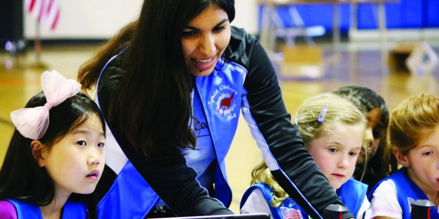 Shivali Minocha (12) instructs young girls on operating a robot at a Girl Scouts robotics demo. Shivali is currently Marketing & Outreach Captain at Space Cookies and a Girl Scouts ambassador.