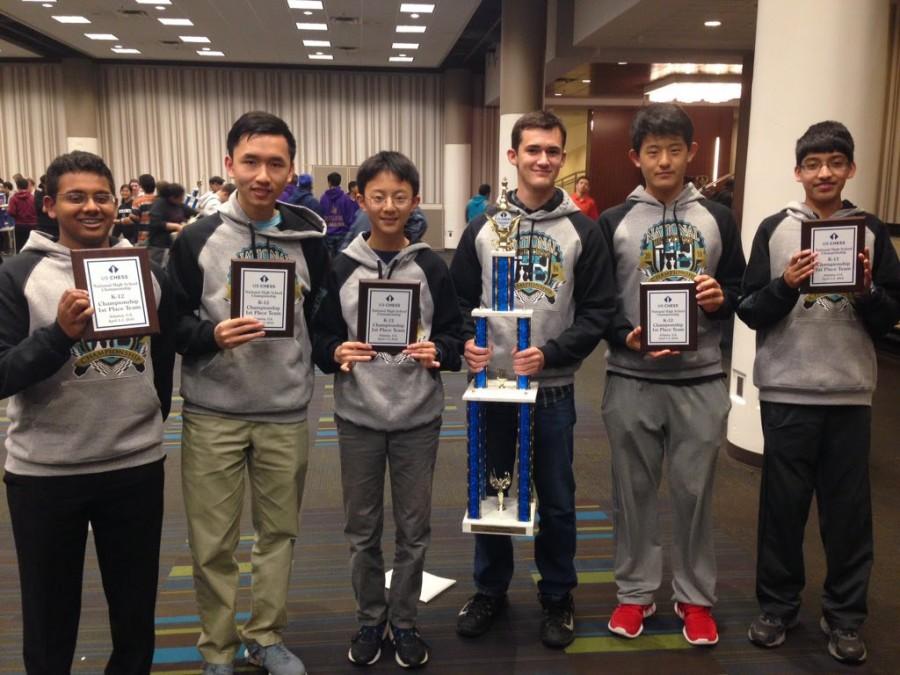 Members of the chess team pose for a photo with their awards. Vignesh placed first in the individual competition, and the team of five won the team championship award. 