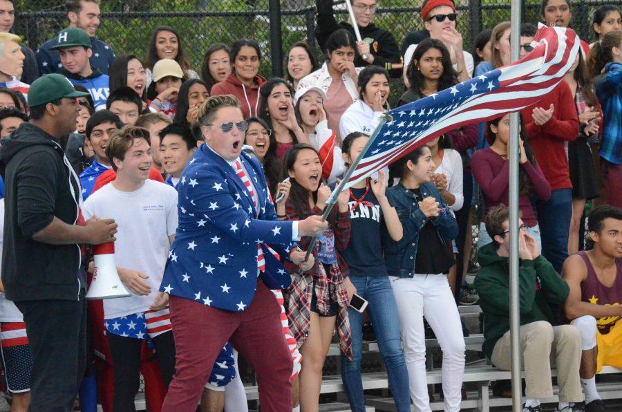 Senior Logan Drazovich waves the American flag and rallies with the senior class during the regatta. The seniors class theme was America.