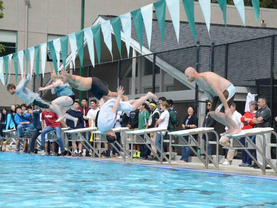 Members of faculty participate in the belly flop competition during the regatta. The staff participated in this activity after members of each class completed their diving rounds.