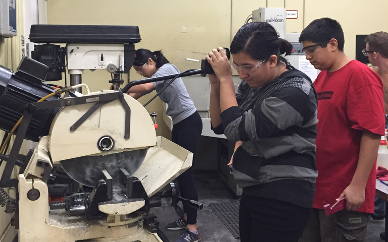 Sarah Gonzalez (11) participates in metal shop training. The Subatomic Smarticles will travel to St. Louis to participate in the World Championship from April 27-30.