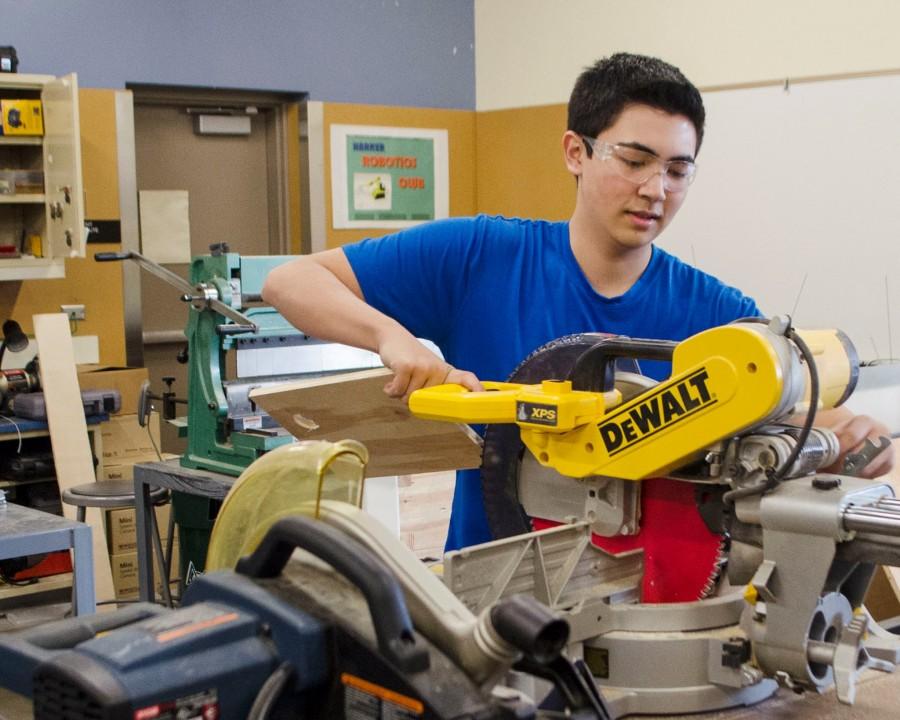 Vice President of Mechanical Fabrication Isaac Smith (12) works on the robot during Team 1072's build season. The team will showcase its program to incoming freshmen at AnswerQuest on April 19.