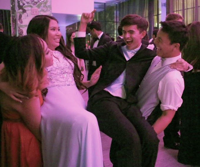 Oisin Coveney (12) picks up Philip Krause (12) and dances along to the music as Janet Lee (12) and Lisa Liu (12) look on. Prom took place at the GlassHouse in downtown San Jose from 8:30 to midnight on Saturday.