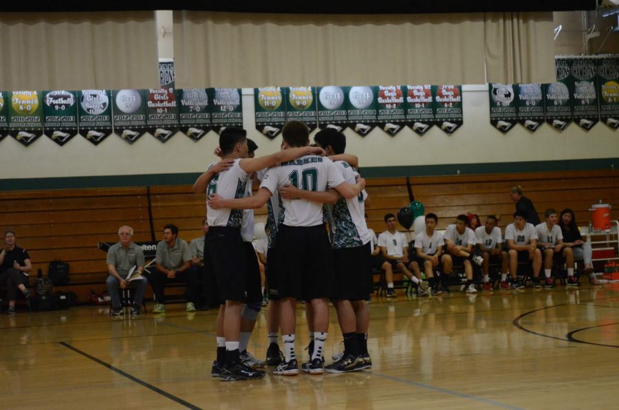 The team huddles during the volleyball match. The boys won senior night 3-0.