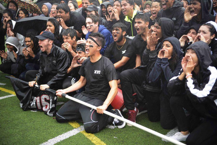 Led by spirit coordinator Edward Sheu (12), the senior class participates in their last scream-off of high school during the rally. Despite rainy weather, upper school students closed Spirit Week by competing in the annual Spirit Rally on Davis Field on April 22. 