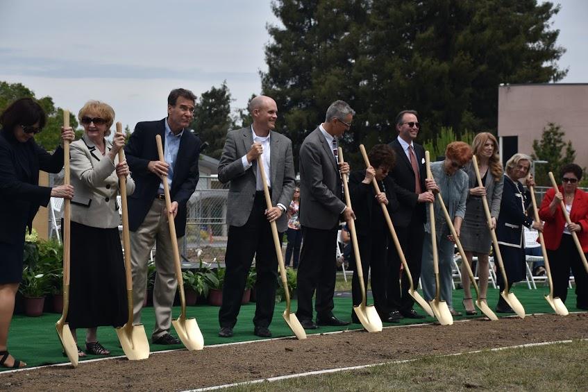 Donors use golden shovels to throw soil off a plot of land on Rosenthal Field during the Groundbreaking Ceremony. The ceremony took place on Tuesday May 3 at 1 p.m.