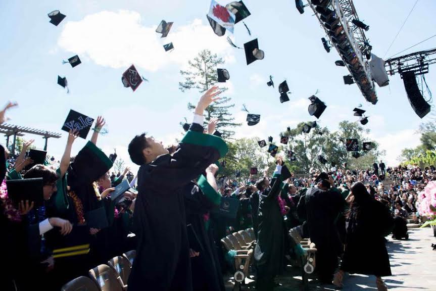 Members of the Class of 2015 throw their caps into the air as they celebrate their graduation from high school. The seniors will graduate this year at the Mountain Winery in Saratoga on May 19.