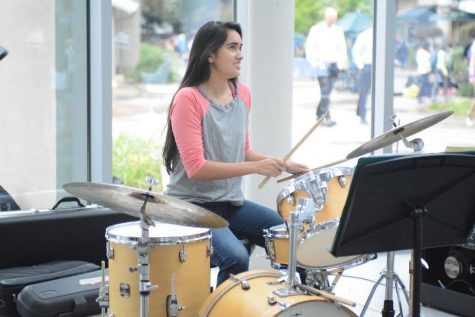 Satchi Thockchom (10) plays the drums during the jazz performance at the event. The Artstravaganza was held in Nichols during long lunch on Wednesday.