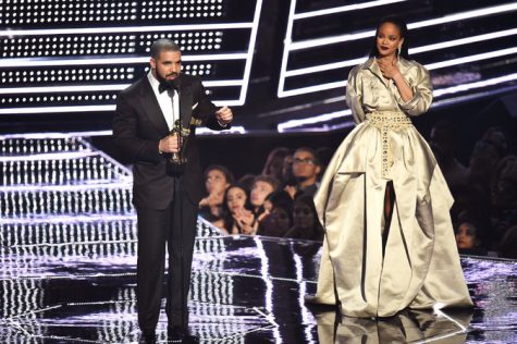 Rapper Drake presents the Michael Jackson Video Vanguard Award to artist Rihanna on the right at the MTV Video Music Awards at the Madison Square Garden, on Sunday, August 28, 2016. 