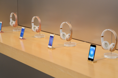 Apple displays a row of iPhone 6s devices along with rose gold Beats headphones. The new iPhone 7 models were already sold out by morning, leaving behind older devices.