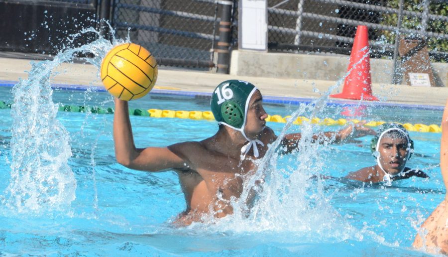 Arnav+Tandon+%2812%29+throws+the+water+polo+ball.+The+boys+lost+11-12+against+Lynbrook+today.