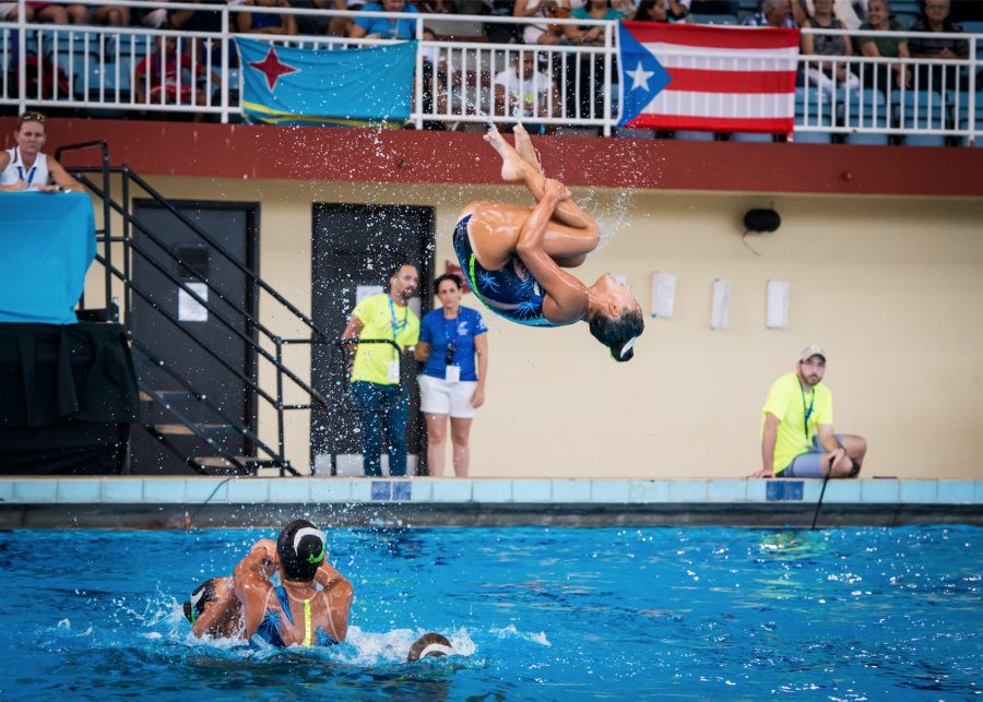 Kate Chow (11) performs a backflip into the depths of the swimming pool. The team placed first at the Union Americana de Natación (UANA)  Pan American Synchronized Swimming Championship in Puerto Rico from Sept. 1 to 4. 
