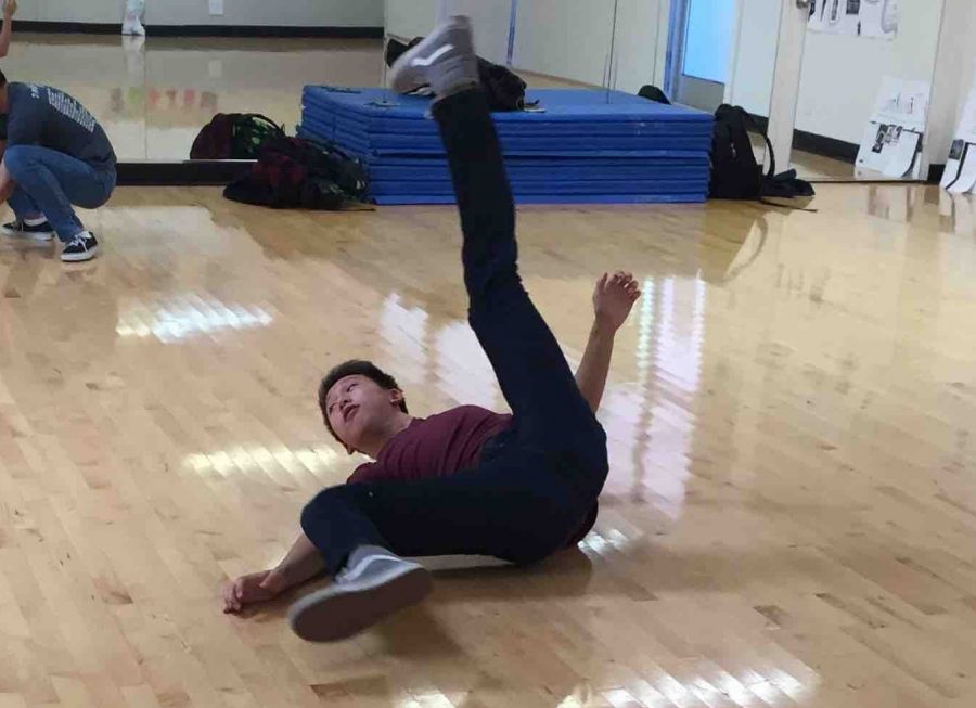 Ethan Hu (9) practices his routine during lunch in the dance room while Kai-Ming Ang (9) plays the soundtrack on his laptop. This years Dance Show will feature two acts: Welcome to the Circus and Daring Acts and Sideshow Freaks.