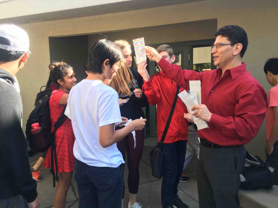 Mr.+Olivas+handed+out+stickers+for+students+to+wear+outside+Manzanita+at+lunch.+Students+wore+red+on+Oct.+11+in+support+for+National+Coming+Out+Day%2C+encouraging+young+people+around+the+world+to+be+confident+in+their+sexuality+and+gender+identity.