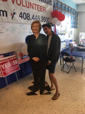 Haris Hosseini (10) takes a photo with a cardboard cutout of Clinton. Students and alumni were involved with campaigns from the local to national levels. 