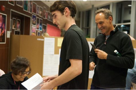 First time voter Nick Haidar arrives at a Westmont Highschool poling place with his father, who takes pictures of this significant moment in his son's citizenship Tuesday evening. 