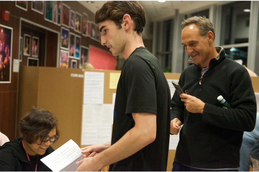 First time voter Nick Haidar arrives at a Westmont Highschool poling place with his father, who takes pictures of this significant moment in his sons citizenship Tuesday evening. 