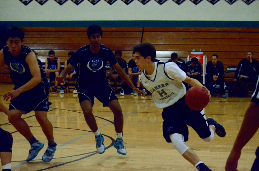 Brando Pakel (11) dribbles the ball down the court. 
