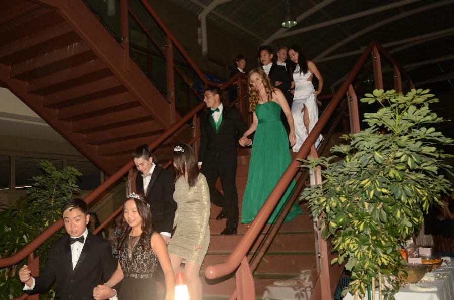 The homecoming court walks down the Nichols staircase to make their entrance.  The dance took place on Friday, Nov. 4 in the Nichols Atrium.