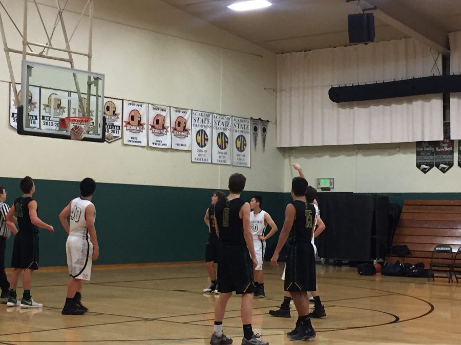 A Harker player makes a free throw during the first quarter of the game. The score at the end of the game was 38-66. 