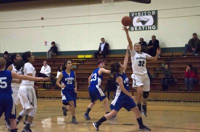 Jordan Thompson (12) takes a lay-up. She scored her 2000th point on her senior night last Friday.