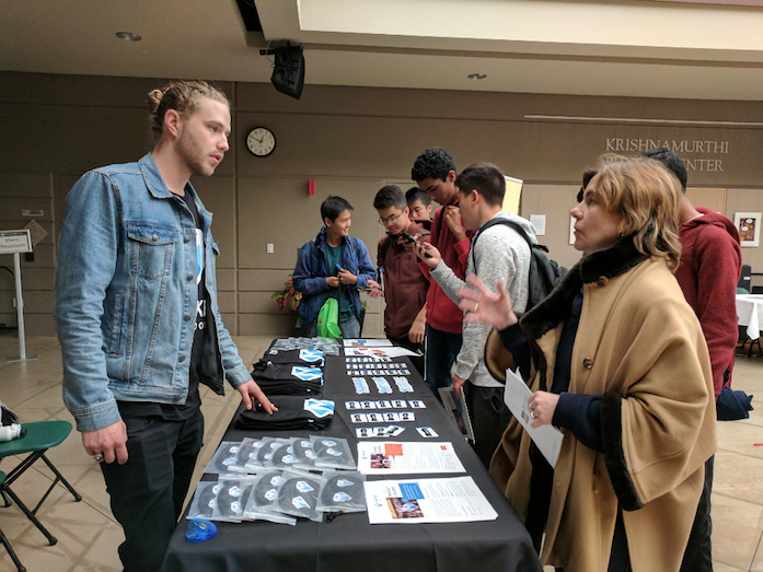 Even Hynes, Make School Head of Community, mands the booth of Make School, which teaches students how to create and publish programming projects. The Harker Programming Invitational was held on Mar. 19. 