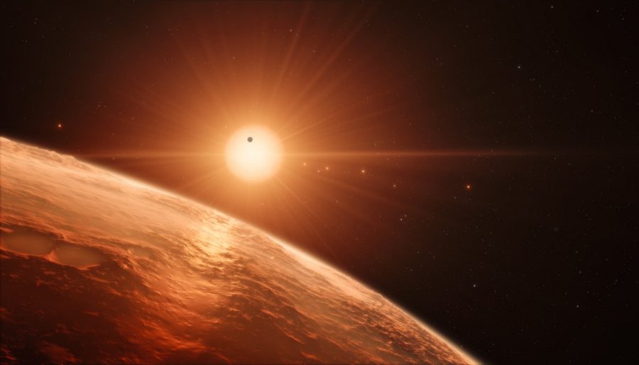 This artist’s impression shows the view from the surface of one of the planets in the TRAPPIST-1 system. At least seven planets orbit this ultra cool dwarf star 40 light-years from Earth and they are all roughly the same size as the Earth. They are at the right distances from their star for liquid water to exist on the surfaces of several of them.