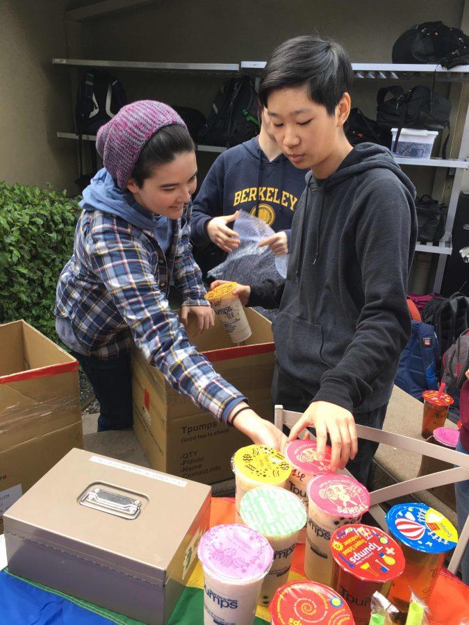 Katrina Ipser (10), Katrina Liu (10) and Kevin Huang (12) organize GSA boba sales outside of Manzanita. GSA members also sold blueberry coffee cake to students and faculty during their club week.