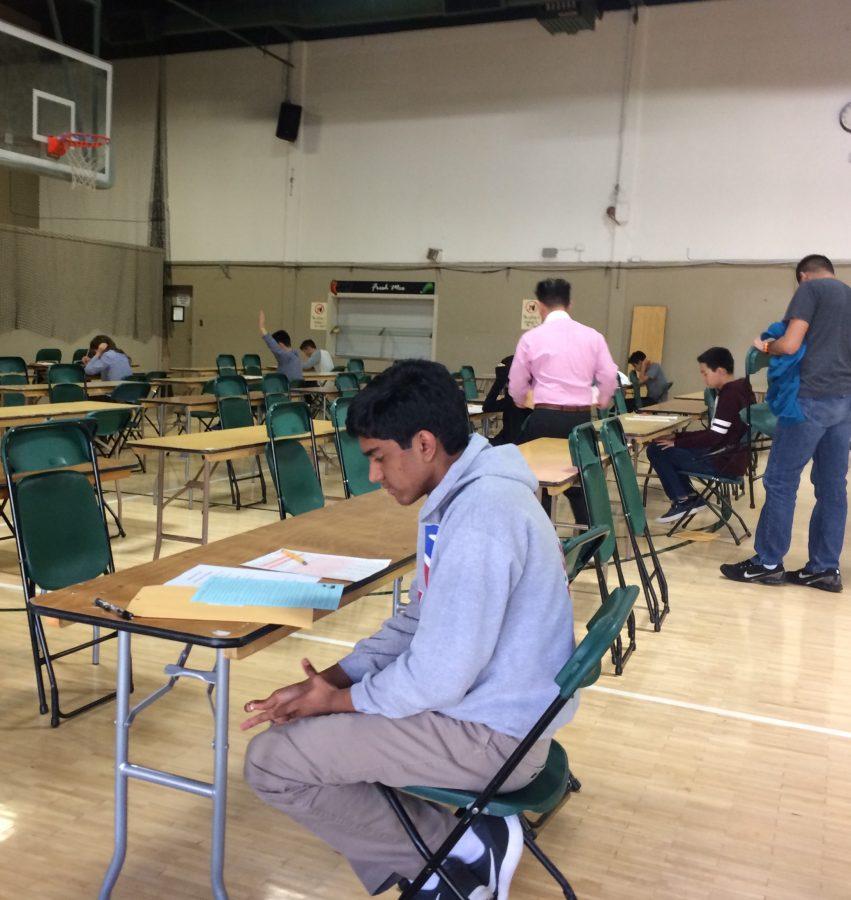 Latin+students+of+all+levels+took+the+annual+National+Latin+Exam+in+the+gym+today.+Director+of+Standardized+Testing+and+Scheduling+Derek+Kameda+proctored+the+test.