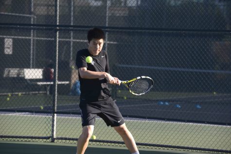 David Wen (11) hits a backhand. He plays number one singles for the Harker varsity boys tennis team. 